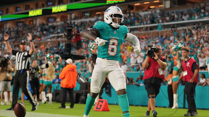 Aug 23, 2025; Miami Gardens, Florida, USA; Miami Dolphins wide receiver Malik Washington (6) celebrates after scoring a touchdown against the Jacksonville Jaguars during the second quarter at Hard Rock Stadium. Mandatory Credit: Sam Navarro-Imagn Images