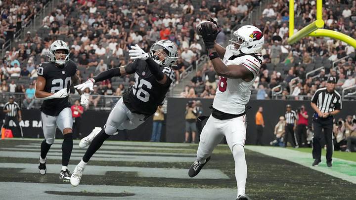 Aug 13, 2026; Paradise, Nevada, USA; Arizona Cardinals wide receiver Marvin Harrison Jr. (18) catches a 7-yard touchdown pass against Las Vegas Raiders cornerback Darien Porter (26)lin the first half at Allegiant Stadium. Mandatory Credit: Kirby Lee-Imagn Images Aug 13, 2026; Paradise, Nevada, USA; Arizona Cardinals wide receiver Marvin Harrison Jr. (18) catches a 7-yard touchdown pass against Las Vegas Raiders cornerback Darien Porter (26)lin the first half at Allegiant Stadium. Mandatory Credit: Kirby Lee-Imagn Images