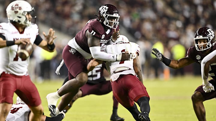 Nov 16, 2024; College Station, Texas, USA; Texas A&M Aggies defensive lineman Nic Scourton (11) defends in coverage against the New Mexico State Aggies during the first half at Kyle Field. Mandatory Credit: Maria Lysaker-Imagn Images 