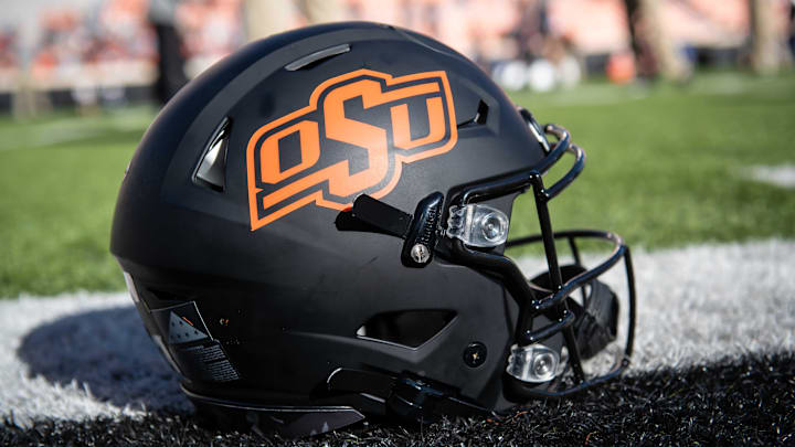 Nov 16, 2019; Stillwater, OK, USA; General view of an Oklahoma State Cowboys helmet resting on the field before the game against the Kansas Jayhawks at Boone Pickens Stadium. Mandatory Credit: Rob Ferguson-Imagn Images