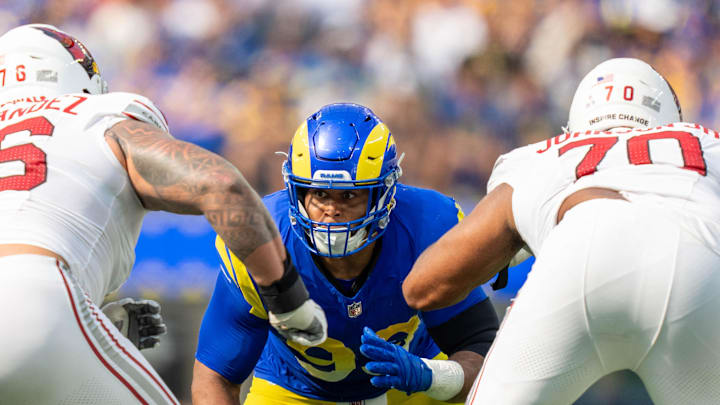 October 15, 2023; Inglewood, California, USA; Los Angeles Rams defensive tackle Aaron Donald (99) rushes during the second quarter against the Arizona Cardinals at SoFi Stadium. Mandatory Credit: Kyle Terada-Imagn Images