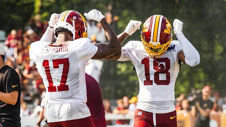 Washington Commanders wide receivers Terry McLaurin (17) and Stefon Diggs (18) celebrate together during training camp practice in Ashburn, Virginia. Washington Commanders wide receivers Terry McLaurin (17) and Stefon Diggs (18) celebrate together during training camp practice in Ashburn, Virginia.