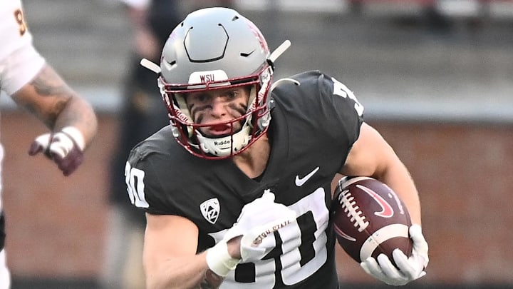 Nov 12, 2022; Pullman, Washington, USA; Washington State Cougars running back Dylan Paine (30) carries the ball against the Arizona State Sun Devils in the second half at Gesa Field at Martin Stadium. Mandatory Credit: James Snook-Imagn Images