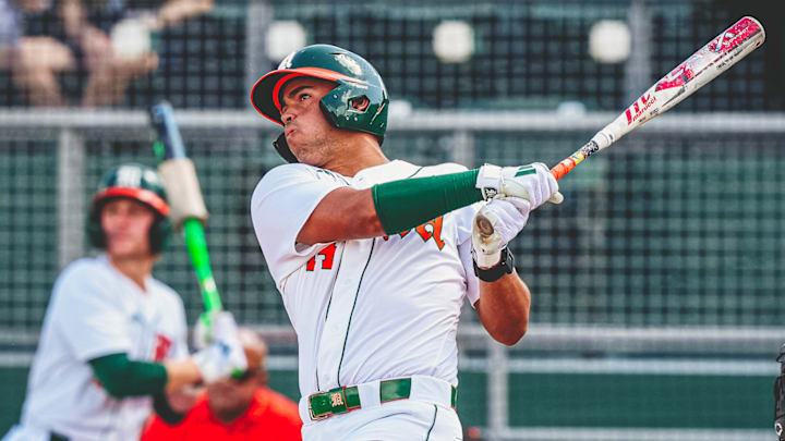 Miami Hurricanes third baseman Daniel Cuvet is smashing a home run against Lehigh.