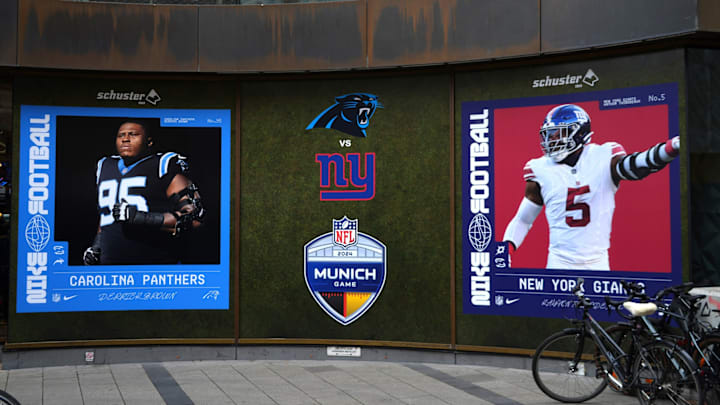 Nov 8, 2024; Munich, Germany; A Nike Football advertisement featuring images of Carolina Panthers defensive end Derrick Brown (95) and New York Giants linebacker Kayvon Thibodeaux (5) at the Schuster sporting goods store. 