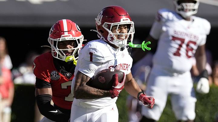 Oklahoma Sooners wide receiver Isaiah Sategna III (1) runs after a catch against Georgia Bulldogs safety Khalil Barnes (7) during the first half at Sanford Stadium. Mandatory Credit: Dale Zanine-Imagn Images Oklahoma Sooners wide receiver Isaiah Sategna III (1) runs after a catch against Georgia Bulldogs safety Khalil Barnes (7) during the first half at Sanford Stadium. Mandatory Credit: Dale Zanine-Imagn Images