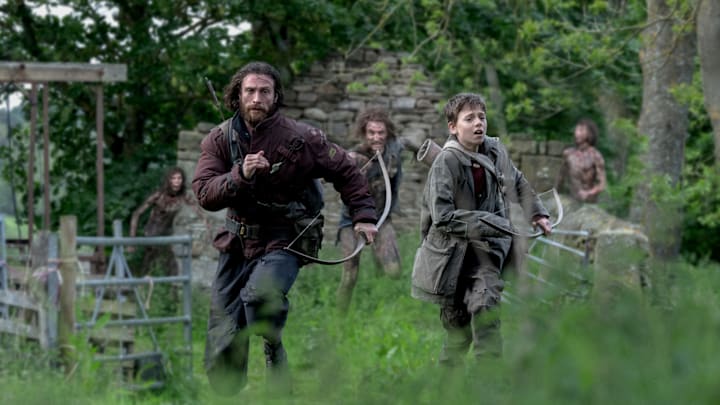 Jamie (Aaron Taylor-Johnson) and his son Spike (Alfie Williams) in Columbia Pictures' 28 YEARS LATER.