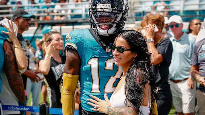 Sep 21, 2025; Jacksonville, Florida, USA; Jacksonville Jaguars player Travis Hunter (12) with his wife during pregame against the Houston Texans at EverBank Stadium.