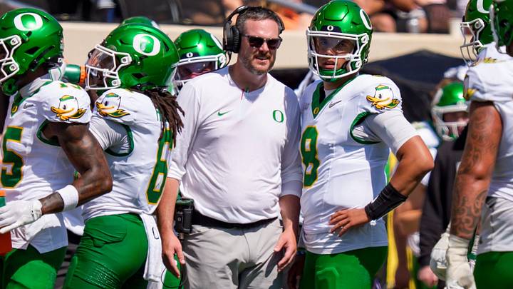 Oregon head coach Dan Lanning talks to Oregon quarterback Dylan Raiola on the sideline as the Oregon Ducks face the Oklahoma State Cowboys on Sept. 12, 2026, at Boone Pickens Stadium in Stillwater, Oklahoma. Oregon head coach Dan Lanning talks to Oregon quarterback Dylan Raiola on the sideline as the Oregon Ducks face the Oklahoma State Cowboys on Sept. 12, 2026, at Boone Pickens Stadium in Stillwater, Oklahoma.