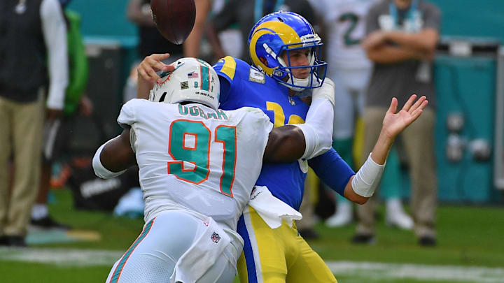 Miami Dolphins defensive end Emmanuel Ogbah (91) forces the fumble of Los Angeles Rams quarterback Jared Goff (16) during the first half at Hard Rock Stadium in a 2020 matchup.