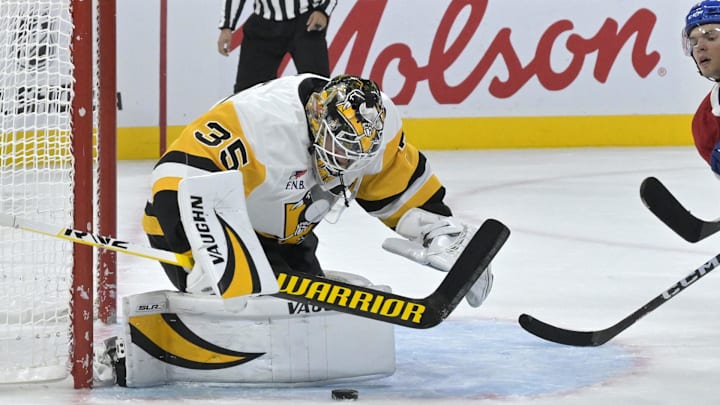Oct 14, 2024; Montreal, Quebec, CAN; Pittsburgh Penguins goalie Tristan Jarry (35) makes a save against the Montreal Canadiens during the second period at the Bell Centre. Mandatory Credit: Eric Bolte-Imagn Images
