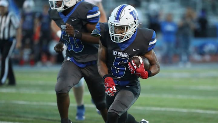 Walled Lake Western running back Donovan Triplett scores against White Lake Lakeland during first-half action at Walled Lake Western High School on Friday, Sept. 22, 2023.