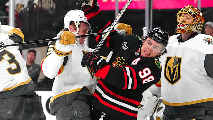 Mar 14, 2026; Las Vegas, Nevada, USA; Vegas Golden Knights defenseman Kaedan Korczak (6) checks Chicago Blackhawks center Connor Bedard (98) during the first period at T-Mobile Arena. Mandatory Credit: Stephen R. Sylvanie-Imagn Images
