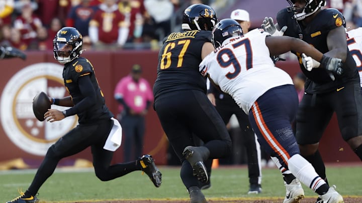 Andrew Billings gives chase to Jayden Daniels in last year's Bears loss to the Commanders.