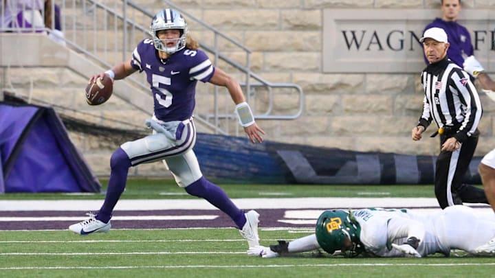 Nov 11, 2023; Manhattan, Kansas, USA; Kansas State Wildcats running back Treshaun Ward (9) runs away from Baylor Bears defensive lineman TJ Franklin (9) during the fourth qaurter at Bill Snyder Family Football Stadium. Mandatory Credit: Scott Sewell-USA TODAY Sports