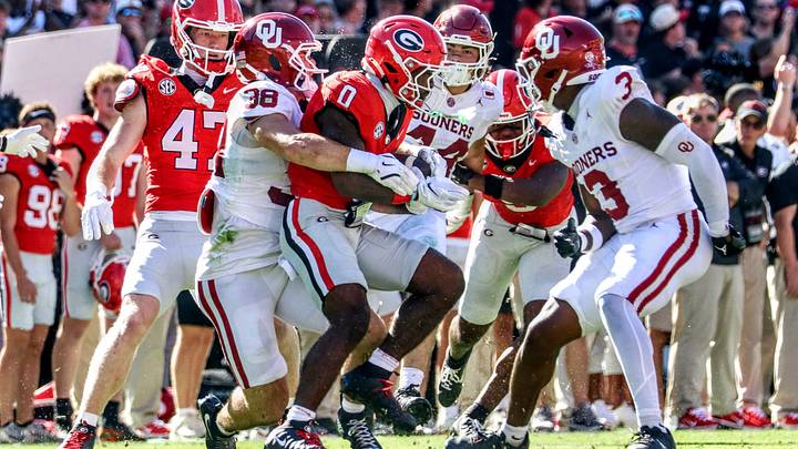 Oklahoma linebacker Owen Heinecke tries to make a tackle against Georgia. After a rough start to the season. the Sooners have improved in tackling. Oklahoma linebacker Owen Heinecke tries to make a tackle against Georgia. After a rough start to the season. the Sooners have improved in tackling.