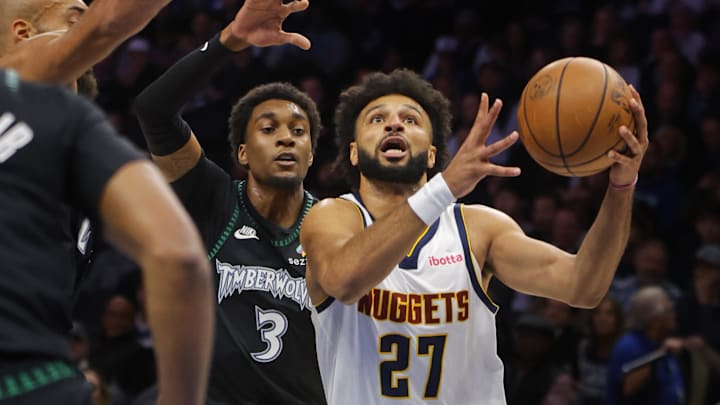 Oct 27, 2025; Minneapolis, Minnesota, USA; Denver Nuggets guard Jamal Murray (27) goes to the basket past Minnesota Timberwolves forward Jaden McDaniels (3) in the first quarter at Target Center. Mandatory Credit: Bruce Kluckhohn-Imagn Images Oct 27, 2025; Minneapolis, Minnesota, USA; Denver Nuggets guard Jamal Murray (27) goes to the basket past Minnesota Timberwolves forward Jaden McDaniels (3) in the first quarter at Target Center. Mandatory Credit: Bruce Kluckhohn-Imagn Images