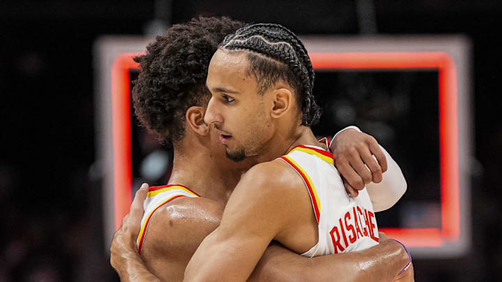 Mar 12, 2026; Atlanta, Georgia, USA; Atlanta Hawks forwards Jalen Johnson (1) and Zaccharie Risacher (10) react after the Hawks defeated the Brooklyn Nets at State Farm Arena. Mandatory Credit: Dale Zanine-Imagn Images