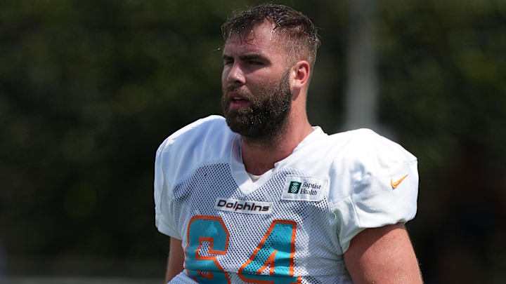 Aug 3, 2022; Miami Gardens, Florida, US; Miami Dolphins offensive lineman Kellen Diesch (64) walks on the field during training camp at Baptist Health Training Complex. Mandatory Credit: Jasen Vinlove-Imagn Images