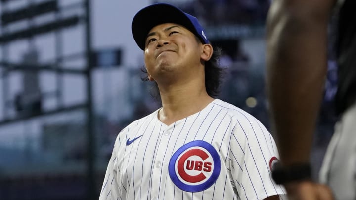 Jun 4, 2024; Chicago, Illinois, USA; Chicago Cubs pitcher Shota Imanaga (18) grimaces after giving up an infield single against the Chicago White Sox during the second inning at Wrigley Field.