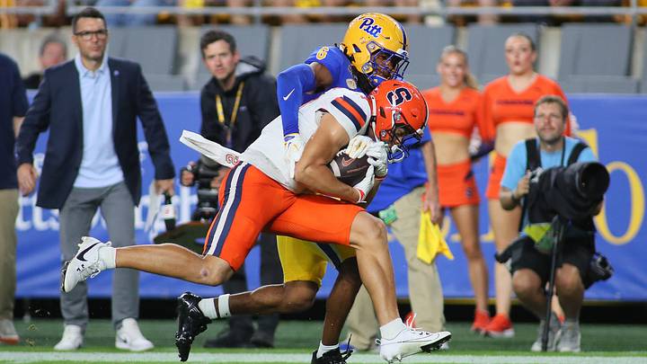 Syracuse wide receiver Cole Weaver gets wrapped up by Pittsburgh defensive back Raion Strader. The Orange lost, 27–13, and were eliminated from CFP contention. Syracuse wide receiver Cole Weaver gets wrapped up by Pittsburgh defensive back Raion Strader. The Orange lost, 27–13, and were eliminated from CFP contention.