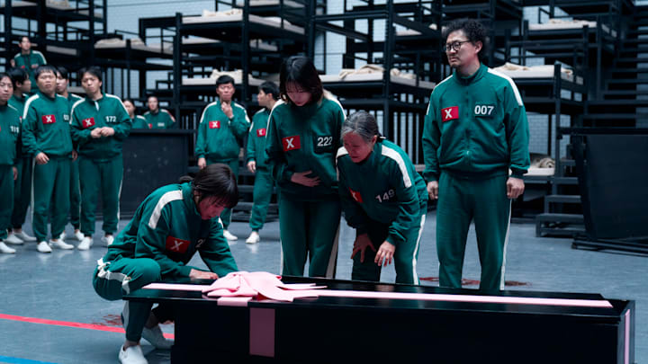 Park Sung-hoon as Cho Hyun-ju, Jo Yu-ri as Kim Jun-hee, Kang Ae-sim as Jang Geum-ja, Yang Dong-geun as Park Yong-sik in Squid Game season 3