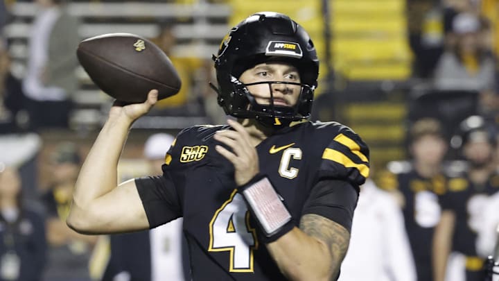 Sep 19, 2024; Boone, North Carolina, USA; Appalachian State Mountaineers quarterback Joey Aguilar (4) throws a pass over South Alabama Jaguars linebacker Aakil Washington (10) during the second half at Kidd Brewer Stadium. Mandatory Credit: Reinhold Matay-Imagn Images Sep 19, 2024; Boone, North Carolina, USA; Appalachian State Mountaineers quarterback Joey Aguilar (4) throws a pass over South Alabama Jaguars linebacker Aakil Washington (10) during the second half at Kidd Brewer Stadium. Mandatory Credit: Reinhold Matay-Imagn Images