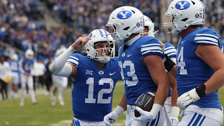 Quarterback Jake Retzlaff celebrates with Isaac Rex as the Cougars score a touchdown