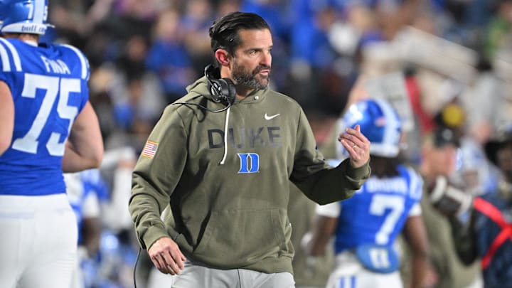 Nov 15, 2025; Durham, North Carolina, USA;  Duke Blue Devils head coach Manny Diaz reacts during the third quarter against the Virginia Cavaliers at Wallace Wade Stadium. Mandatory Credit: Zachary Taft-Imagn Images