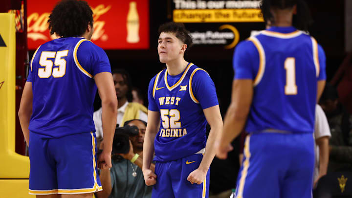 Jan 21, 2026; Tempe, Arizona, USA; West Virginia Mountaineers forward Treysen Eaglestaff (52) celebrates a shot with teammates against the Arizona State Sun Devils in the second half at Desert Financial Arena. Mandatory Credit: Mark J. Rebilas-Imagn Images