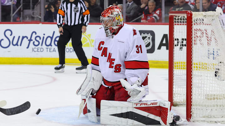 Apr 25, 2025; Newark, New Jersey, USA; Carolina Hurricanes goaltender Frederik Andersen (31) makes a save against the New Jersey Devils during the first overtime in game three of the first round of the 2025 Stanley Cup Playoffs at Prudential Center. Mandatory Credit: Ed Mulholland-Imagn Images
