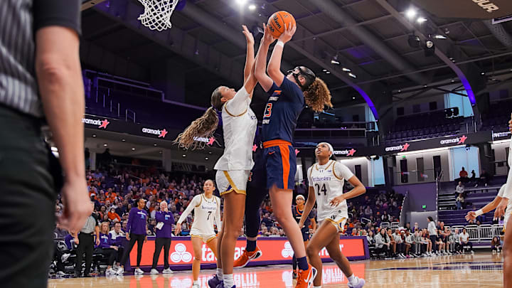 Illinois forward Berry Wallace elevates for a shot over a Northwestern defender in the Illini's 92-65 win over the Wildcats on Sunday at Welsh-Ryan Arena in Evanston, Illinois.