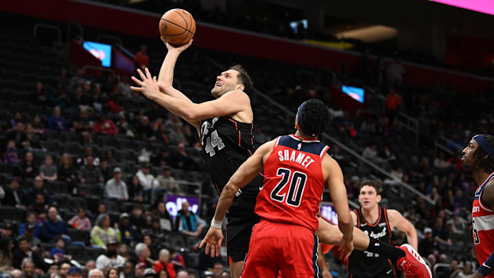 Jan 27, 2024; Detroit, Michigan, USA; Detroit Pistons forward Bojan Bogdanovic (44) shoots the ball over Washington Wizards guard Landry Shamet (20) in the first quarter at Little Caesars Arena. Mandatory Credit: Lon Horwedel-Imagn Images Jan 27, 2024; Detroit, Michigan, USA; Detroit Pistons forward Bojan Bogdanovic (44) shoots the ball over Washington Wizards guard Landry Shamet (20) in the first quarter at Little Caesars Arena. Mandatory Credit: Lon Horwedel-Imagn Images