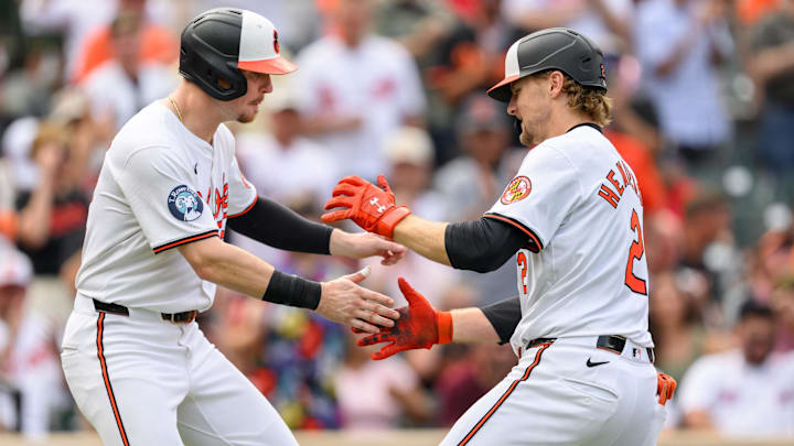 Aug 18, 2024; Baltimore, Maryland, USA; Baltimore Orioles shortstop Gunnar Henderson (2) celebrates with first baseman Ryan O'Hearn (32) after hitting a home run during the sixth inning against the Boston Red Sox at Oriole Park at Camden Yards