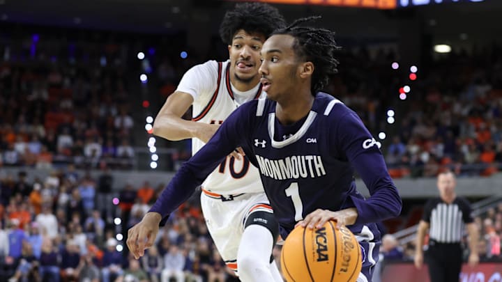 Dec 30, 2024; Auburn, Alabama, USA; Monmouth Hawks guard Abdi Bashir Jr. (1) gets past Auburn Tigers guard Chad Baker-Mazara (10) during the first half at Neville Arena. Mandatory Credit: John Reed-Imagn Images Dec 30, 2024; Auburn, Alabama, USA; Monmouth Hawks guard Abdi Bashir Jr. (1) gets past Auburn Tigers guard Chad Baker-Mazara (10) during the first half at Neville Arena. Mandatory Credit: John Reed-Imagn Images