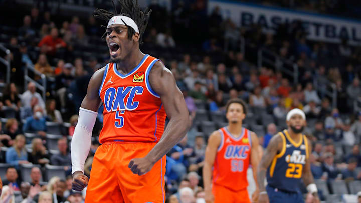OKC's Lu Dort (5) celebrates after a basket against Utah on Nov. 24 at Paycom Center.

cover