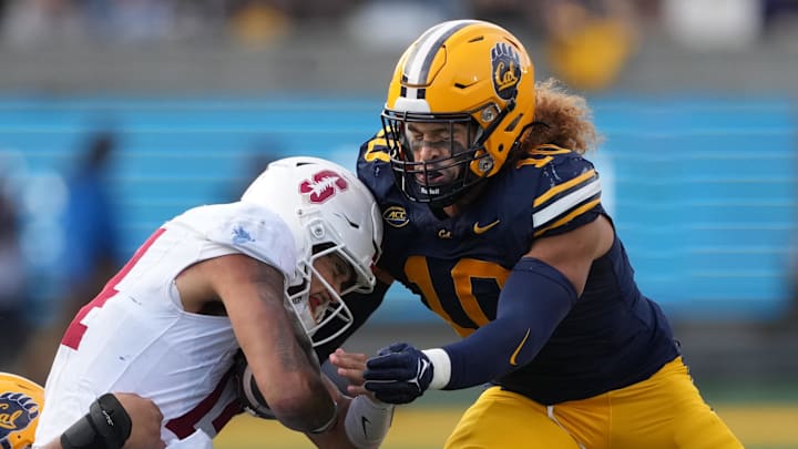 California linebacker Teddye Buchanan tackles Stanford quarterback Ashton Daniels.