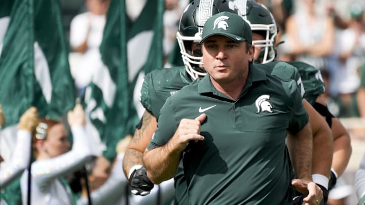 Sep 13, 2025; East Lansing, Michigan, USA; Michigan State head coach Jonathan Smith takes the field before a game against Youngstown State at Spartan Stadium. Mandatory Credit: Brendan Mullin-Imagn Images