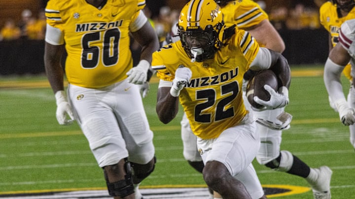 Sept 27, 2025; Columbia, Missouri, USA; Missouri Tigers running back Tavorus Jones (22) rushes in a game against UMass at Faurot Field at Memorial Stadium. Sept 27, 2025; Columbia, Missouri, USA; Missouri Tigers running back Tavorus Jones (22) rushes in a game against UMass at Faurot Field at Memorial Stadium.