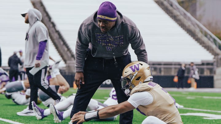 John Richardson chats up quarterback Demond Williams Jr. during stretching. John Richardson chats up quarterback Demond Williams Jr. during stretching.
