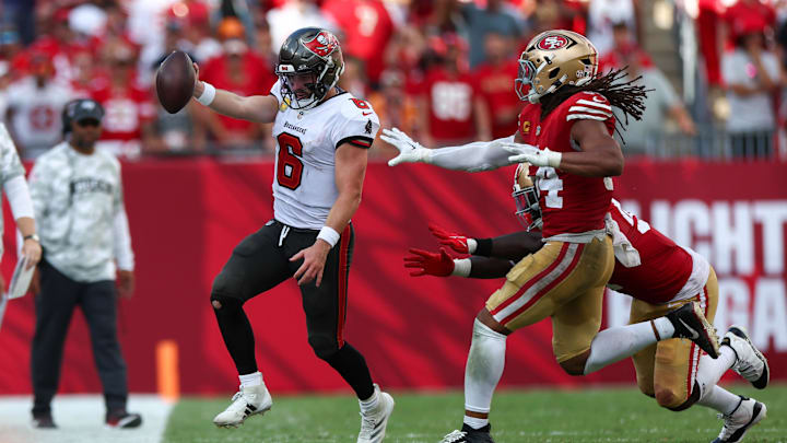 Nov 10, 2024; Tampa, Florida, USA; Tampa Bay Buccaneers quarterback Baker Mayfield (6) runs with the ball against the San Francisco 49ers in the fourth quarter at Raymond James Stadium.  