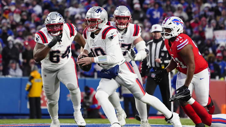 Dec 22, 2024; Orchard Park, New York, USA; New England Patriots quarterback Drake Maye (10) runs with the ball against the Buffalo Bills during the first half at Highmark Stadium. Mandatory Credit: Gregory Fisher-Imagn Images