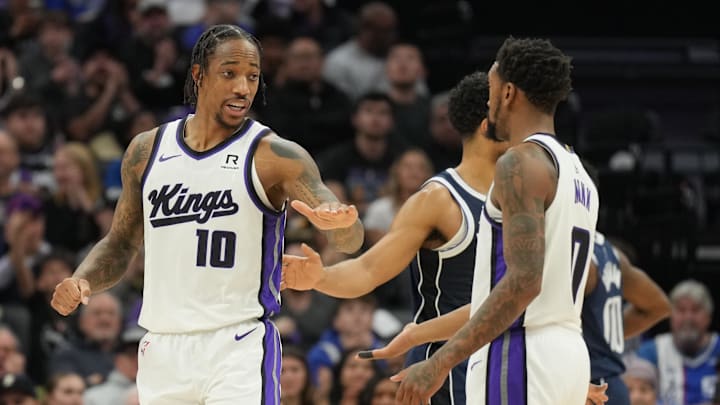 Dec 30, 2024; Sacramento, California, USA; Sacramento Kings forward DeMar DeRozan (10) talks with guard Malik Monk (right) during the second quarter against the Dallas Mavericks at Golden 1 Center. Mandatory Credit: Darren Yamashita-Imagn Images Dec 30, 2024; Sacramento, California, USA; Sacramento Kings forward DeMar DeRozan (10) talks with guard Malik Monk (right) during the second quarter against the Dallas Mavericks at Golden 1 Center. Mandatory Credit: Darren Yamashita-Imagn Images