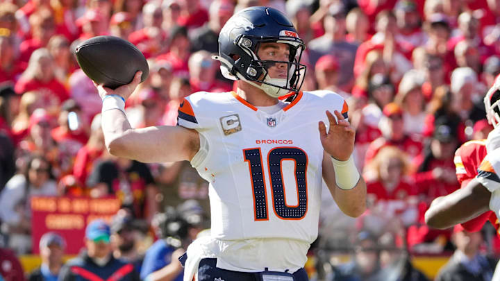 Nov 10, 2024; Kansas City, Missouri, USA; Denver Broncos quarterback Bo Nix (10) throws a pass against the Kansas City Chiefs during the first half at GEHA Field at Arrowhead Stadium. Mandatory Credit: Denny Medley-Imagn Images