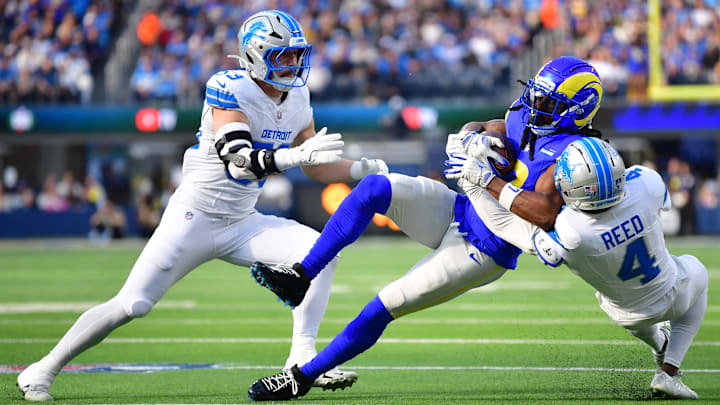 Dec 14, 2025; Inglewood, California, USA; Los Angeles Rams wide receiver Davante Adams (17) catches a pass against Detroit Lions linebacker Trevor Nowaske (53) and Detroit Lions cornerback D.J. Reed (4) during the first quarter at SoFi Stadium. Mandatory Credit: Gary A. Vasquez-Imagn Images Dec 14, 2025; Inglewood, California, USA; Los Angeles Rams wide receiver Davante Adams (17) catches a pass against Detroit Lions linebacker Trevor Nowaske (53) and Detroit Lions cornerback D.J. Reed (4) during the first quarter at SoFi Stadium. Mandatory Credit: Gary A. Vasquez-Imagn Images