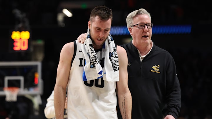 Mar 16, 2023; Birmingham, AL, USA; Iowa Hawkeyes head coach Fran McCaffery and Iowa Hawkeyes guard Connor McCaffery (30) leave the court after losing to the Auburn Tigers in the first round of the 2023 NCAA Tournament at Legacy Arena. Mandatory Credit: Vasha Hunt-Imagn Images Mar 16, 2023; Birmingham, AL, USA; Iowa Hawkeyes head coach Fran McCaffery and Iowa Hawkeyes guard Connor McCaffery (30) leave the court after losing to the Auburn Tigers in the first round of the 2023 NCAA Tournament at Legacy Arena. Mandatory Credit: Vasha Hunt-Imagn Images