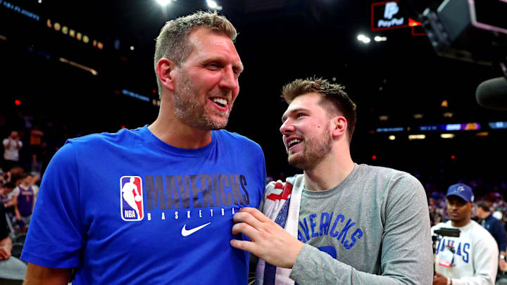 May 15, 2022; Phoenix, Arizona, USA; Dallas Mavericks guard Luka Doncic (77) greets former player Dirk Nowitzki after beating the Phoenix Suns in game seven of the second round for the 2022 NBA playoffs at Footprint Center. Mandatory Credit: Mark J. Rebilas-Imagn Images