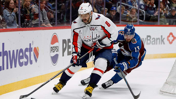 Nov 15, 2024; Denver, Colorado, USA; Washington Capitals left wing Alex Ovechkin (8) controls the puck ahead of Colorado Avalanche right wing Valeri Nichushkin (13) in the third period at Ball Arena. Mandatory Credit: Isaiah J. Downing-Imagn Images
