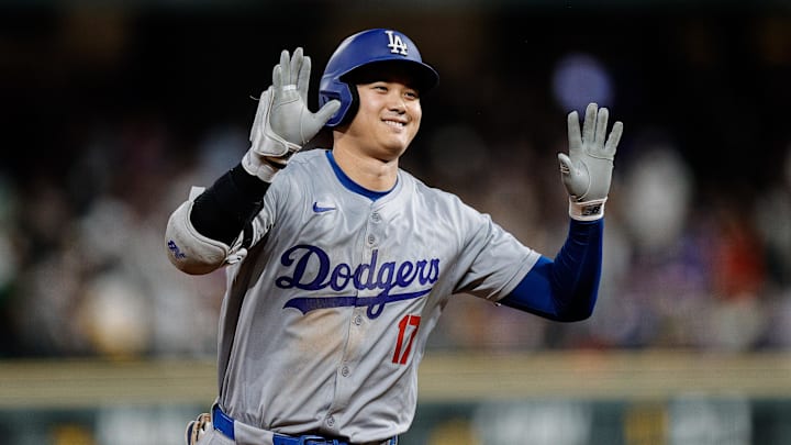 Los Angeles Dodgers designated hitter Shohei Ohtani celebrates after a three-run home run.
