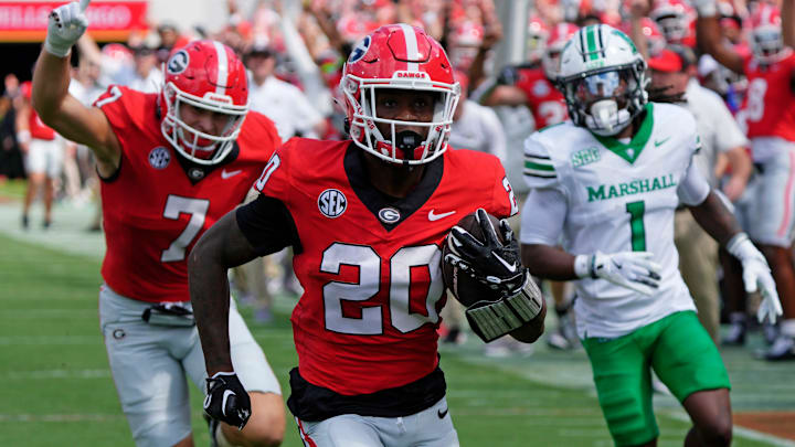 Georgia running back Dwight Phillips Jr (20) drives in for a touchdown during the first half of a NCAA college football game against Marshall in Athens, Ga., on Saturday, August. 30, 2025.